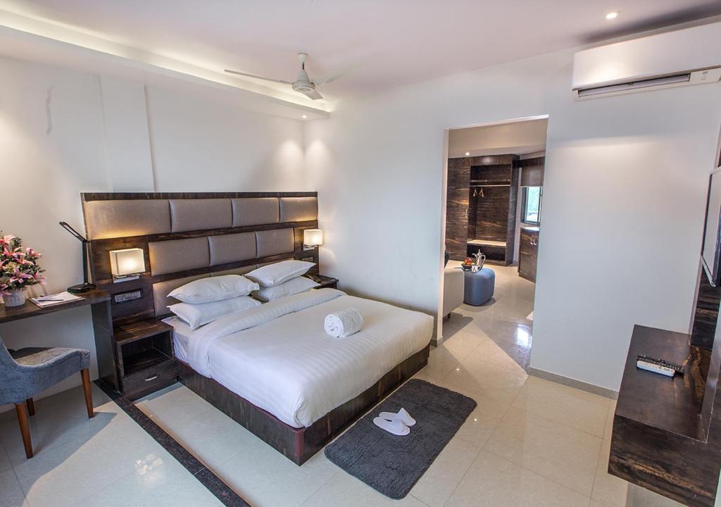 Postel nebo postele na pokoji v ubytování Aura One Hotel