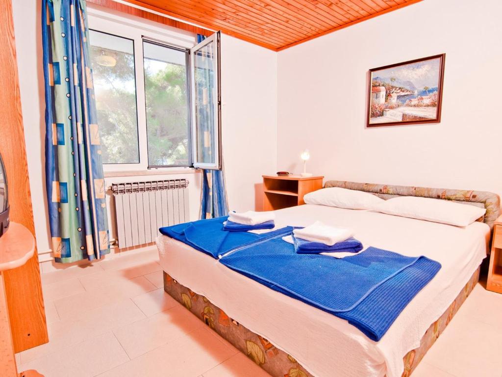 Posteľ alebo postele v izbe v ubytovaní Mali Losinj Apartment 6