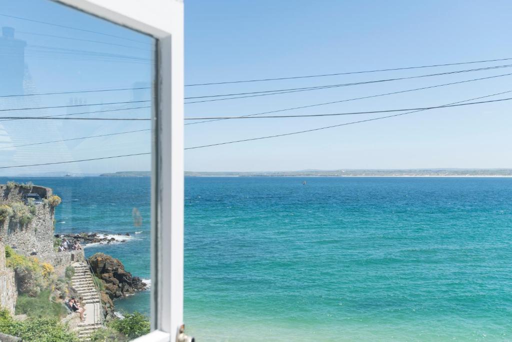 a view of the ocean from a window at Leo's Cottage in St Ives