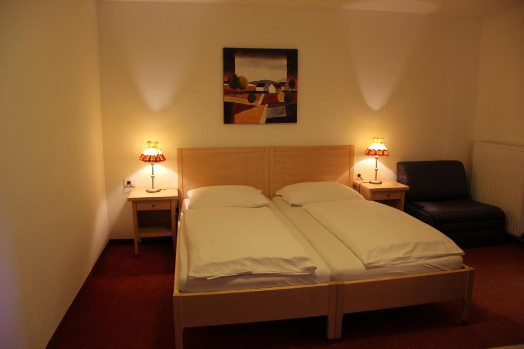 Postel nebo postele na pokoji v ubytování Hotel Hanny