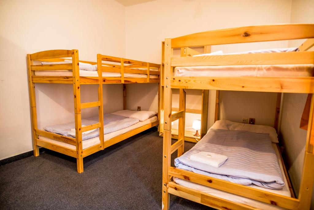 Postel nebo postele na pokoji v ubytování Horský hotel Kozubová