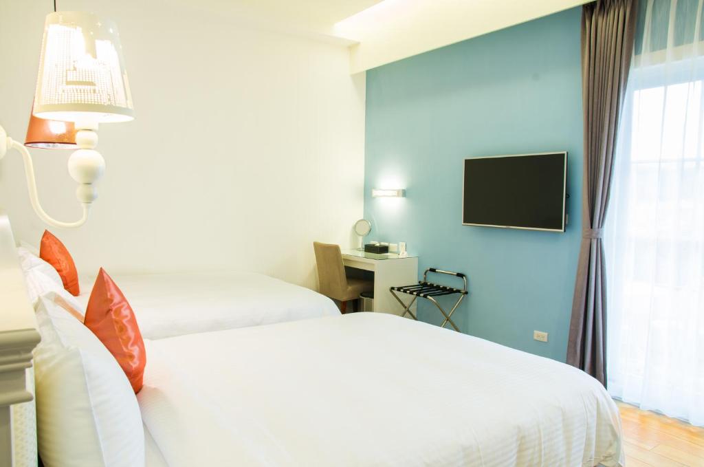 TV a/nebo společenská místnost v ubytování Joy Hotel