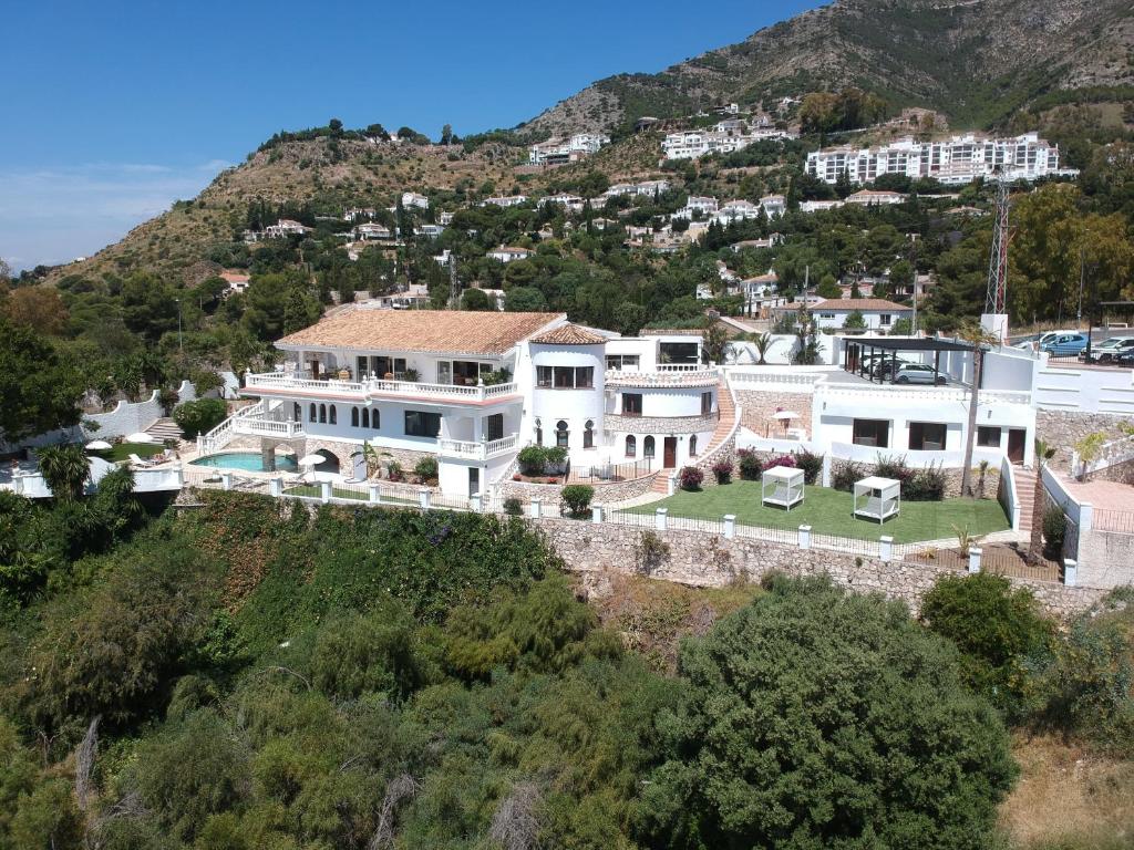 an aerial view of a house on a hill at Mijas Residence in Mijas