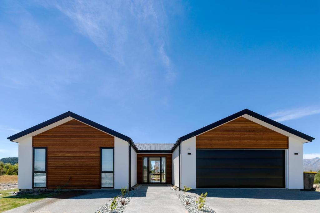 a rendering of a house with two garage doors at Rodman Star Apartment in Lake Tekapo