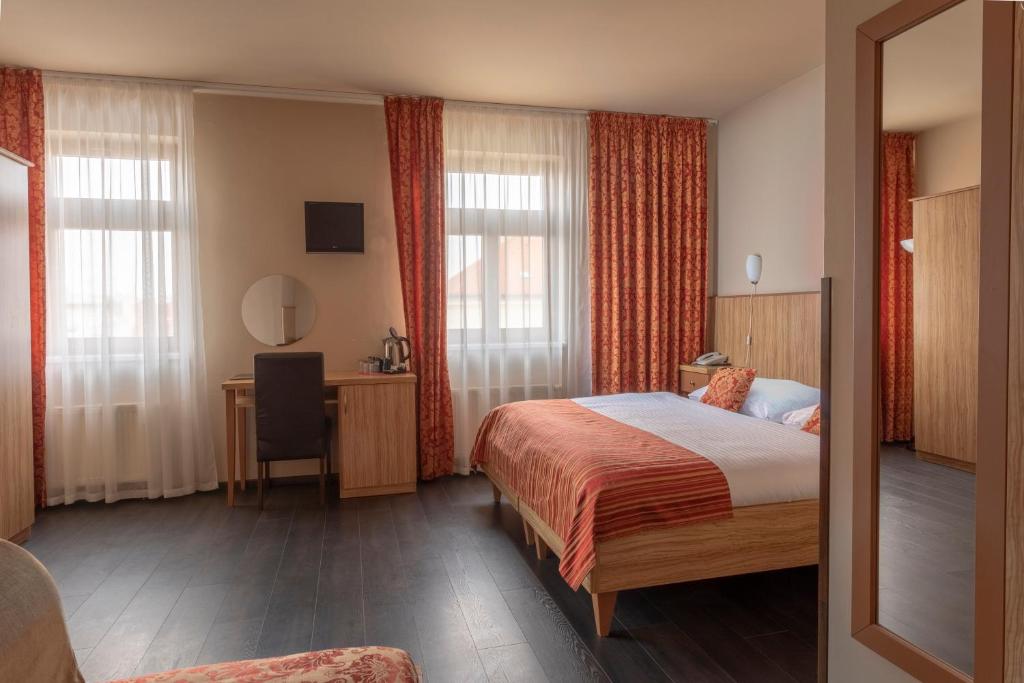 Postel nebo postele na pokoji v ubytování Hotel Superior Prague