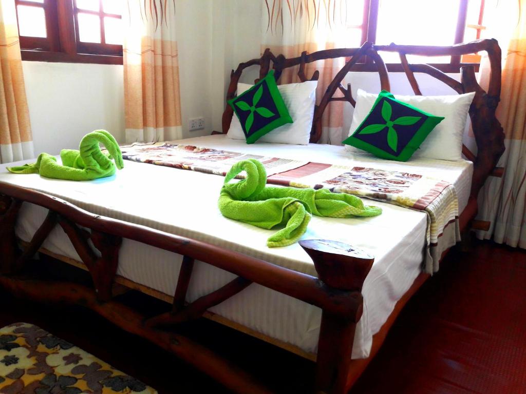 Postel nebo postele na pokoji v ubytování Green Paradise