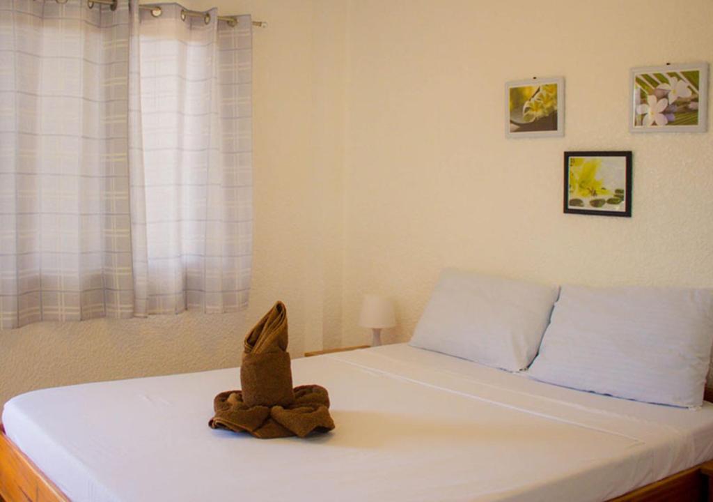 Postel nebo postele na pokoji v ubytování Sunville Hotel and Restaurant