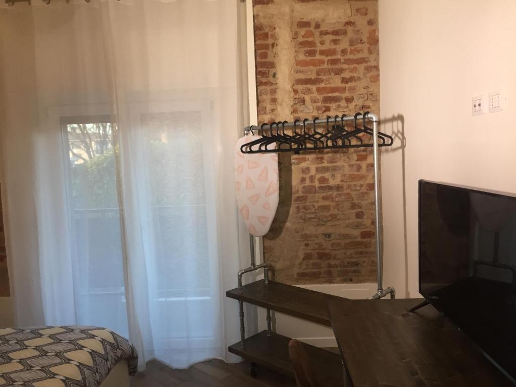 TV a/nebo společenská místnost v ubytování Mazzini 33