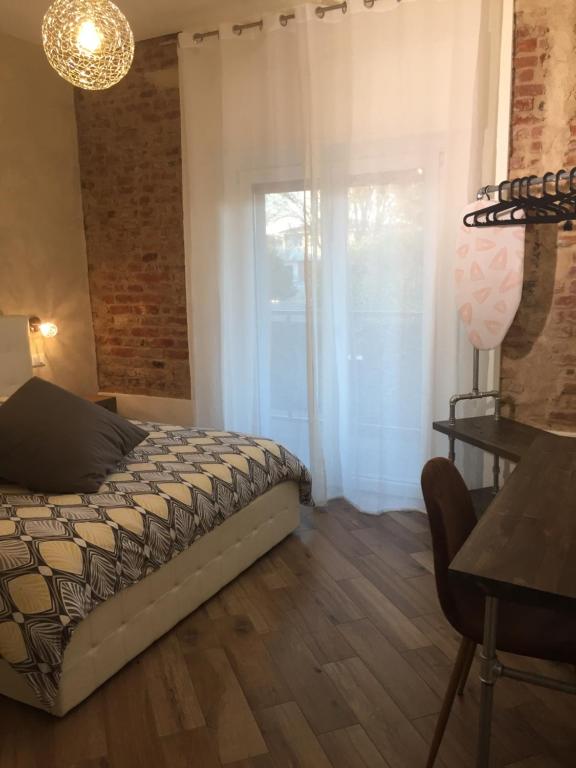 Postel nebo postele na pokoji v ubytování Mazzini 33