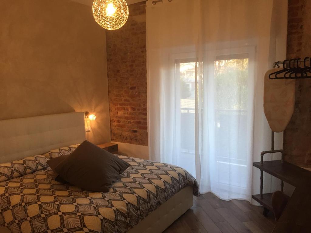 Postel nebo postele na pokoji v ubytování Mazzini 33