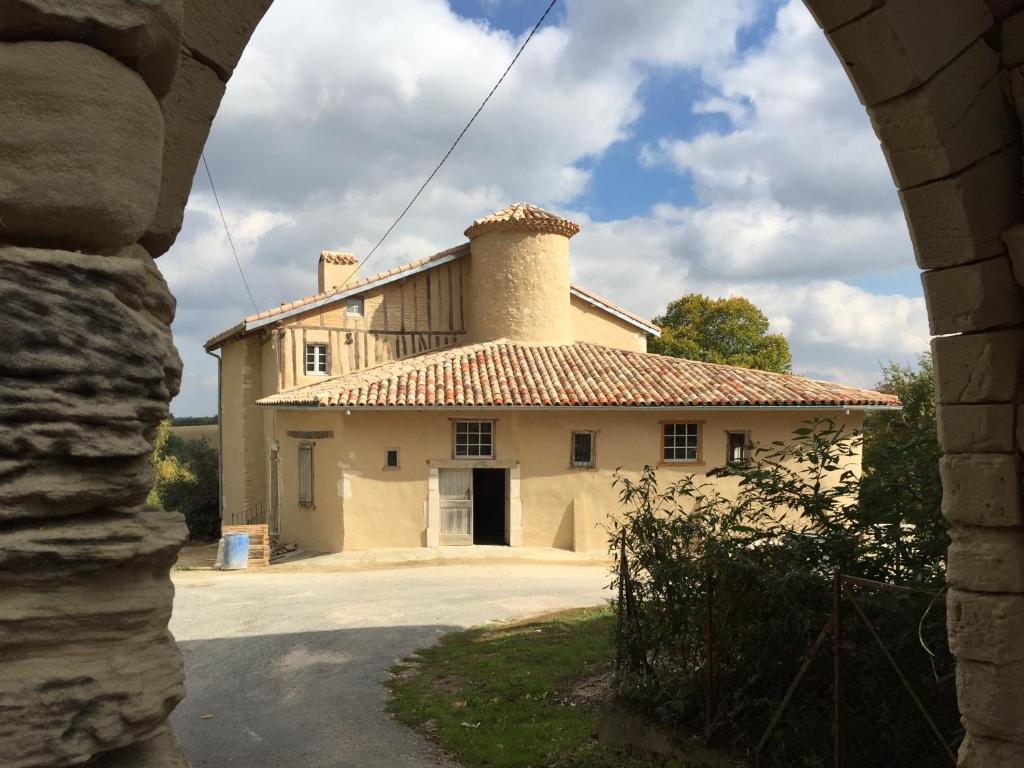 a large building with a chimney on top of it at La Tour Barbacane in Alan