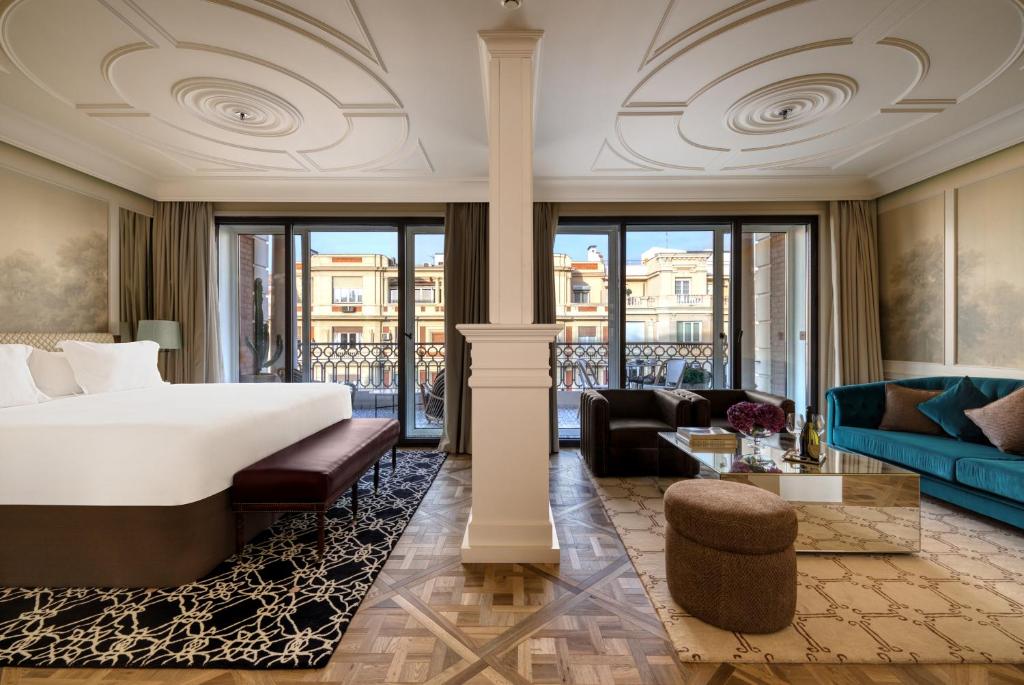 a bedroom with a bed and a living room at BLESS Hotel Madrid - The Leading Hotels of the World in Madrid