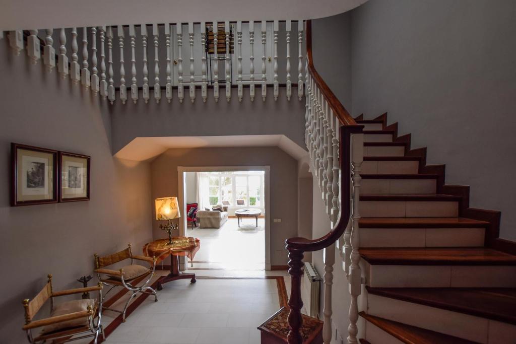 a staircase in a home with a stair case at Villa Antumalal B&B in Málaga