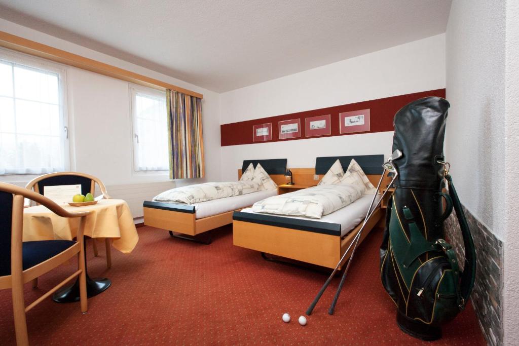 Postel nebo postele na pokoji v ubytování Hotel Arkanum