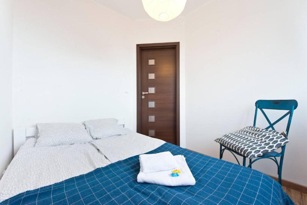 Posteľ alebo postele v izbe v ubytovaní Apartament Zaciszny