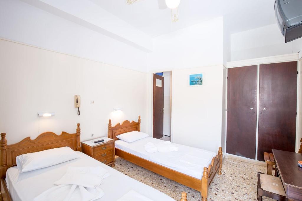 Postel nebo postele na pokoji v ubytování Hotel Sofia