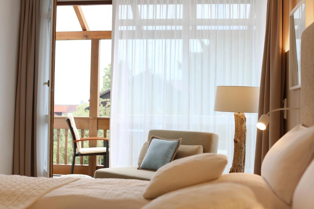 Postel nebo postele na pokoji v ubytování Boutique Hotel Reschen