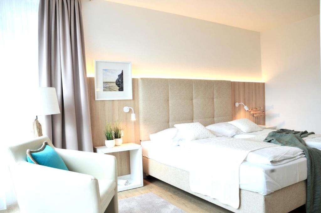 Postel nebo postele na pokoji v ubytování Boutique Hotel Reschen