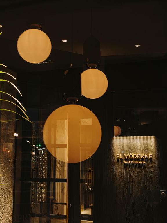 a display window of a store with lights at El Môderne Hotel in Gijón
