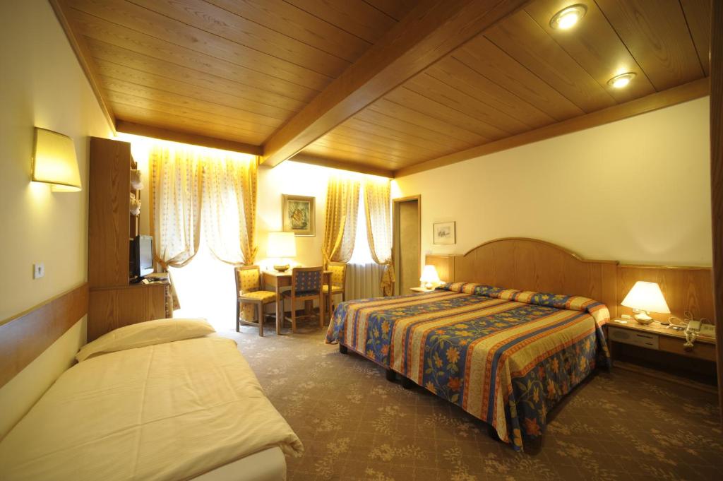 Postel nebo postele na pokoji v ubytování Active Hotel Ancora
