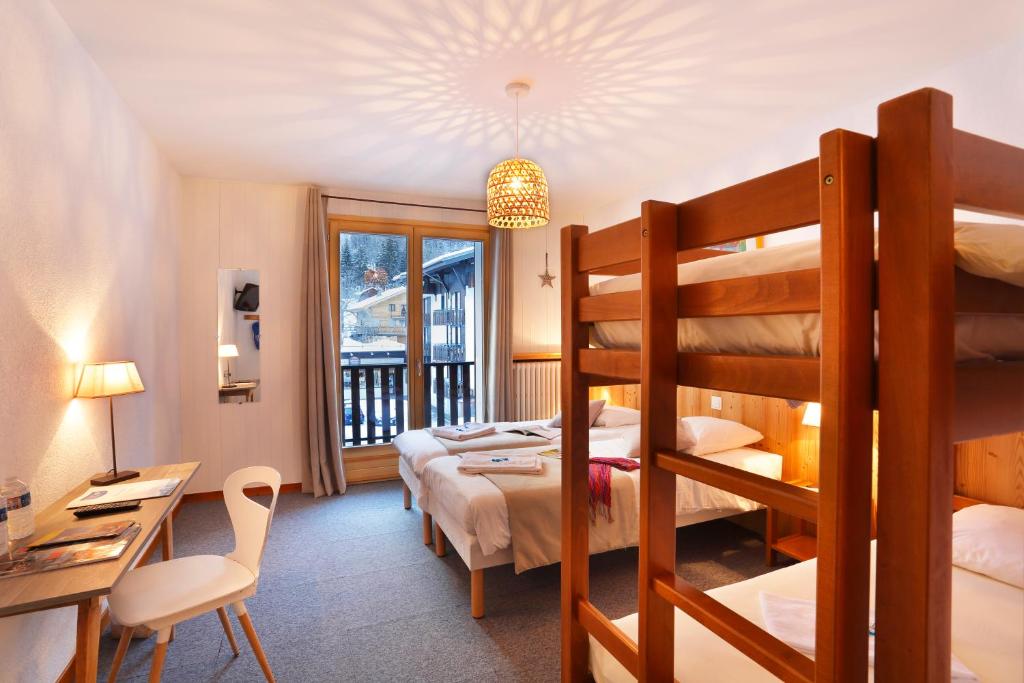 Postel nebo postele na pokoji v ubytování Hôtel Eliova l'Eau Vive