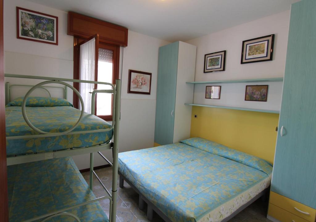 A bed or beds in a room at Villa Agavi