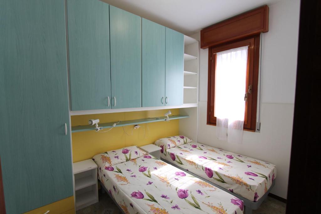A bed or beds in a room at Villa Agavi
