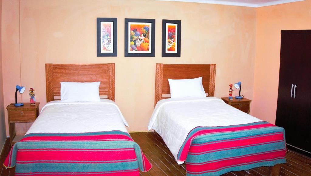 Letto o letti in una camera di Eco Aventura Hostel Cusco