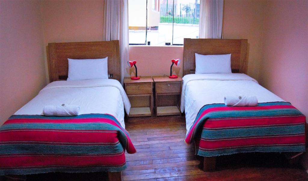 Letto o letti in una camera di Eco Aventura Hostel Cusco