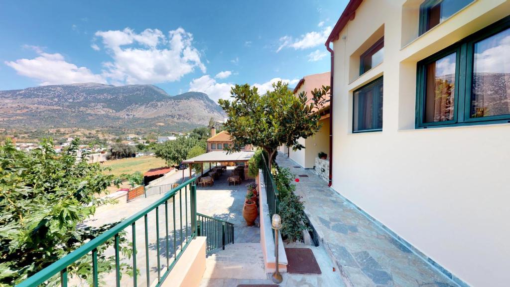 a balcony of a building with a view of a mountain at Nana Apartments in Zaros