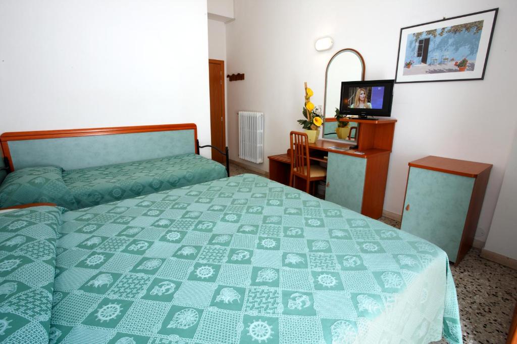 Postel nebo postele na pokoji v ubytování Hotel Vannini