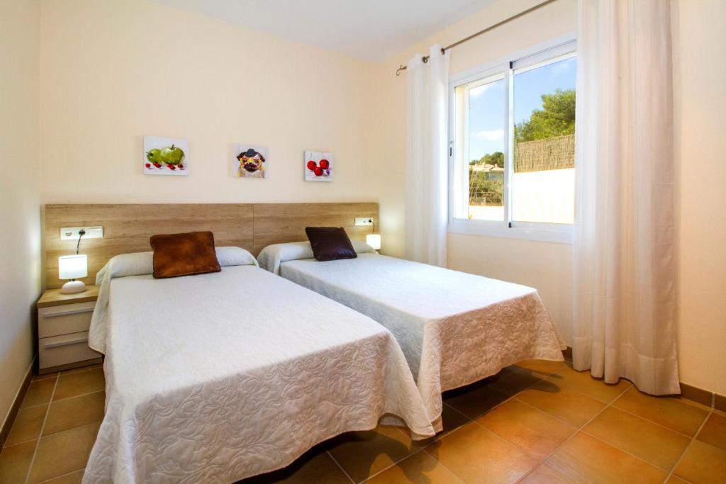 Postel nebo postele na pokoji v ubytování Villa del Mar