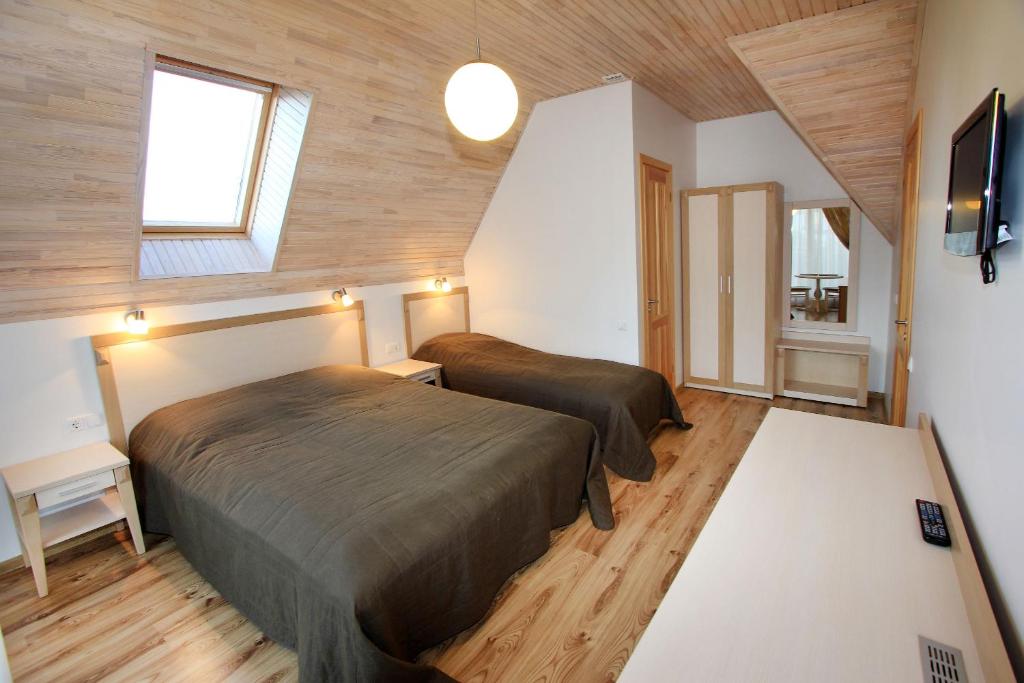 Ένα ή περισσότερα κρεβάτια σε δωμάτιο στο Vila Domino