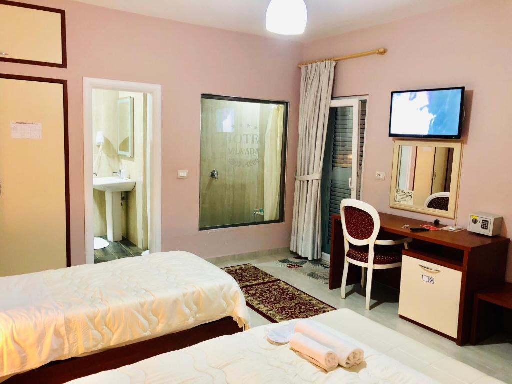 Postel nebo postele na pokoji v ubytování Vila Ada Hotel