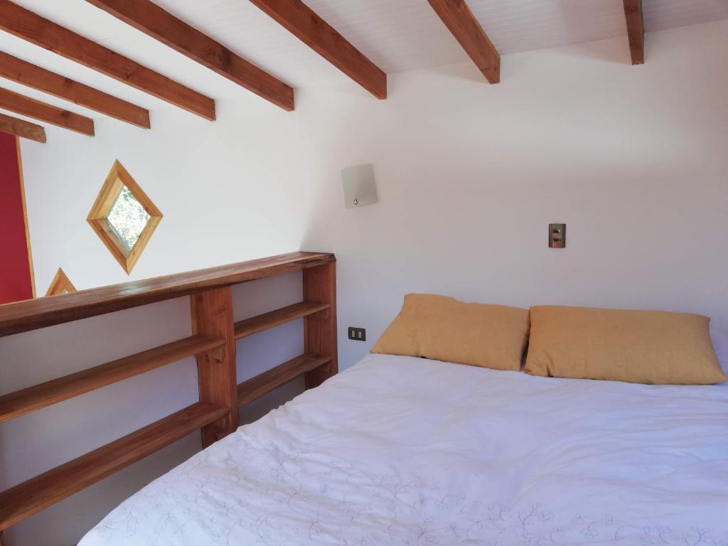 Cama o camas de una habitación en Cabañas Kalfucura