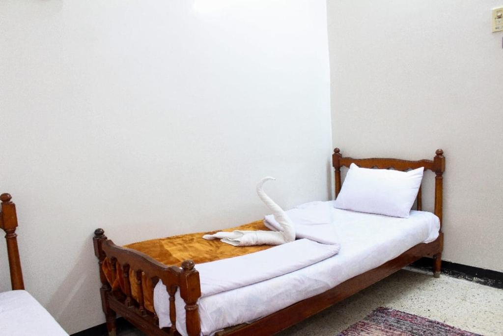 Postel nebo postele na pokoji v ubytování Happy Land Luxor