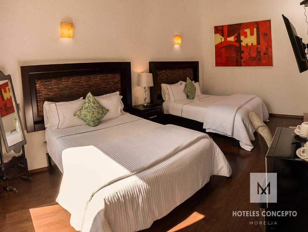 Postel nebo postele na pokoji v ubytování M Hoteles Concepto
