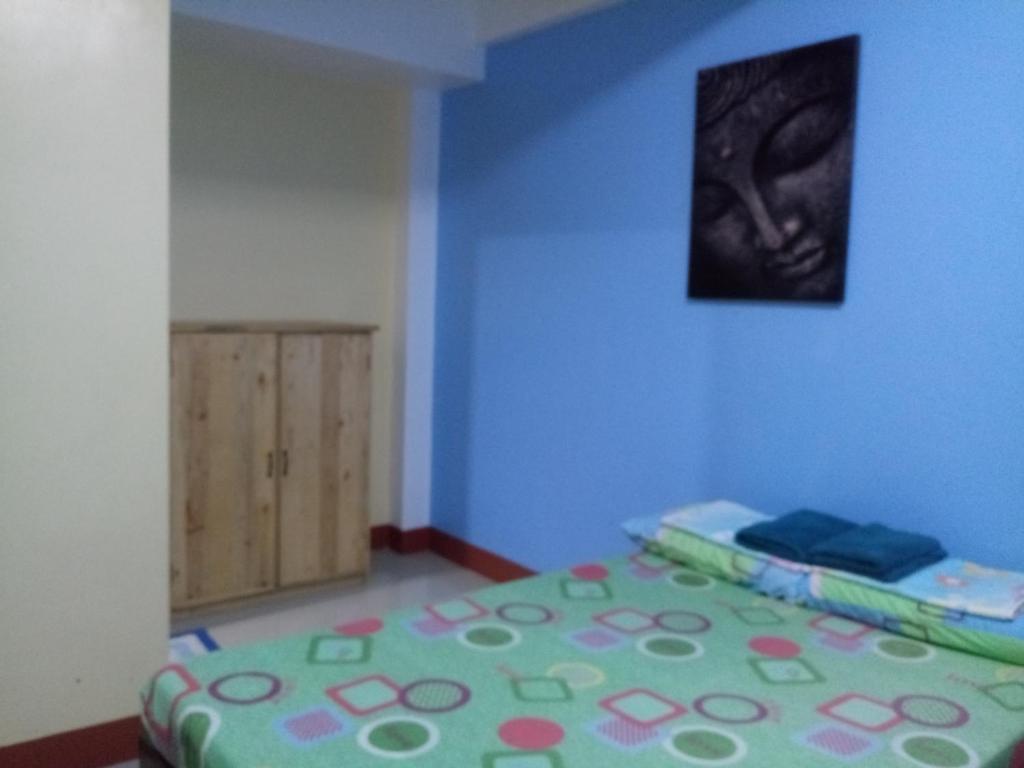 Postel nebo postele na pokoji v ubytování Mayon Lodging House