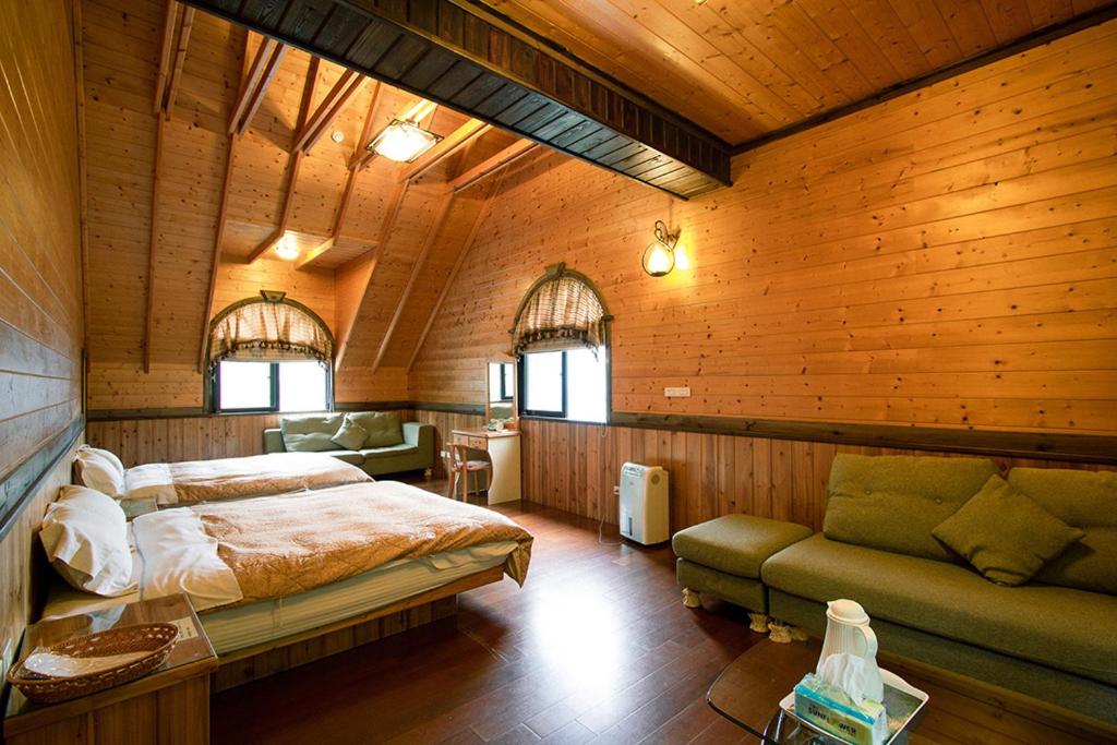 Postel nebo postele na pokoji v ubytování Rong Yuan Gu Homestay