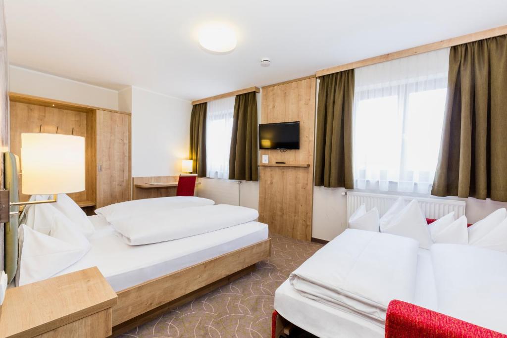 Voodi või voodid majutusasutuse Urdlwirt - Hotel & Restaurant toas