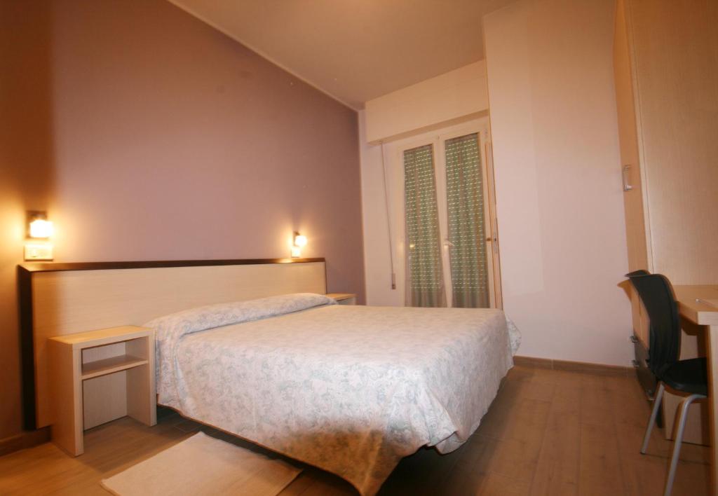 Postel nebo postele na pokoji v ubytování Amoha Hotel - Cattolica