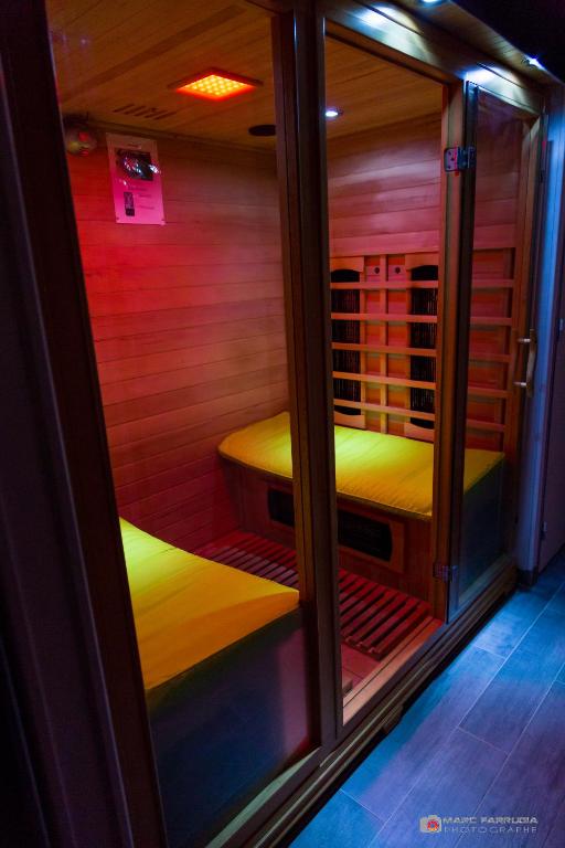 a sauna with two beds in a room at Chambre d&#39;hôtes source de la St Baume in Plan dʼAups