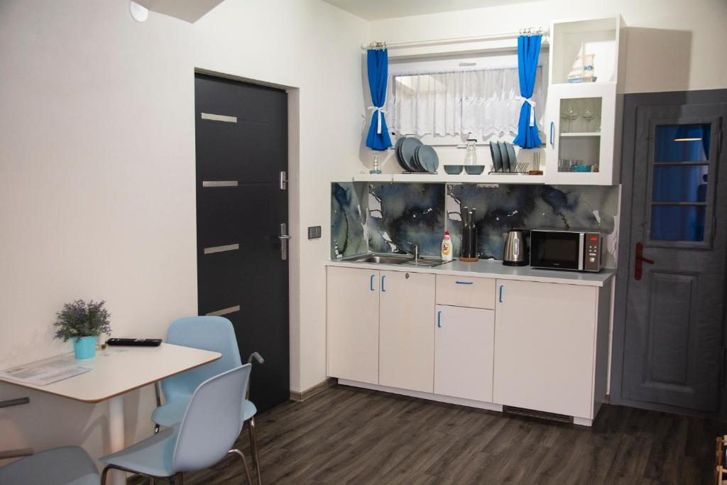 Kuchyň nebo kuchyňský kout v ubytování Apartmán Na Pekárně