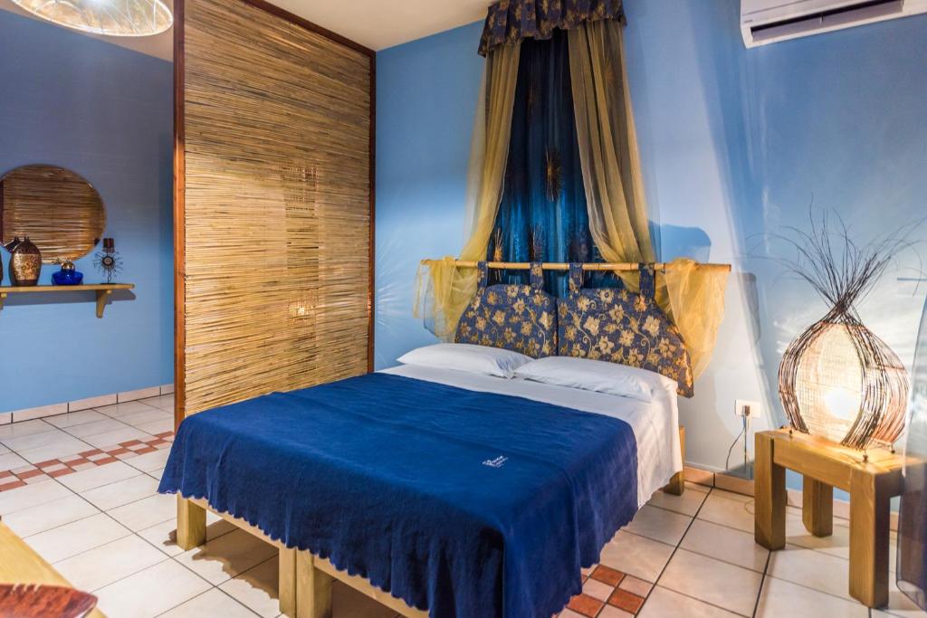 Postel nebo postele na pokoji v ubytování B&B Cinque Stelle Salento
