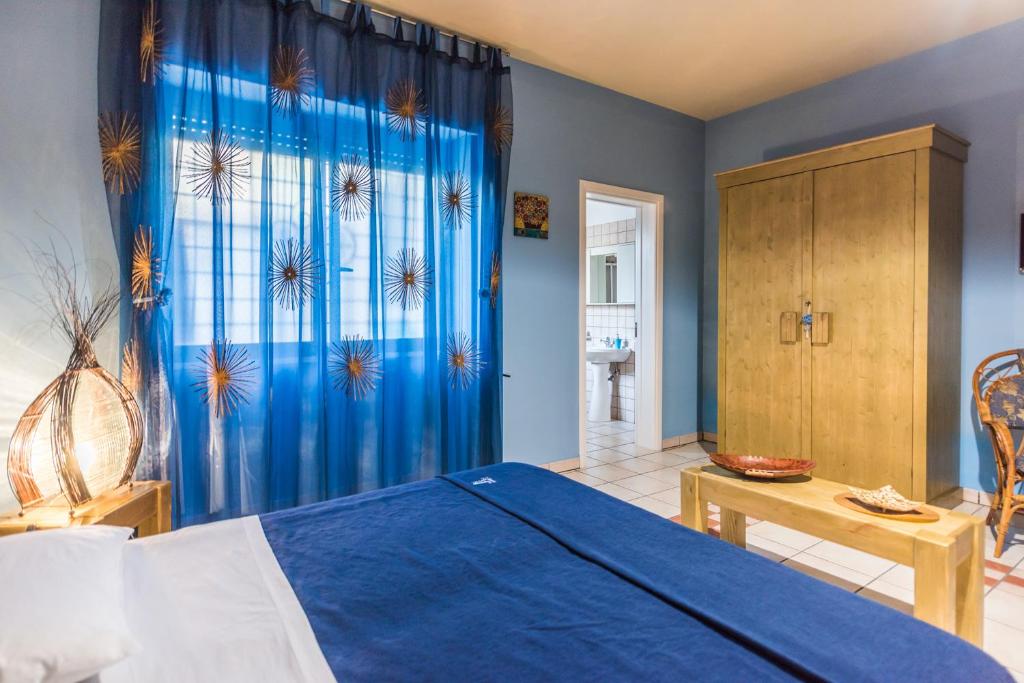 Postel nebo postele na pokoji v ubytování B&B Cinque Stelle Salento