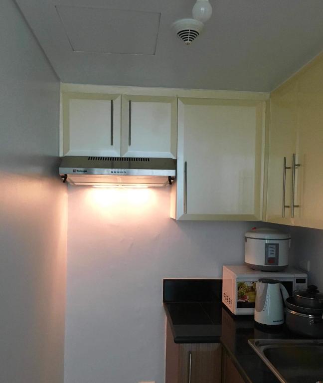 Kuchyň nebo kuchyňský kout v ubytování F-10C Parkside Villas