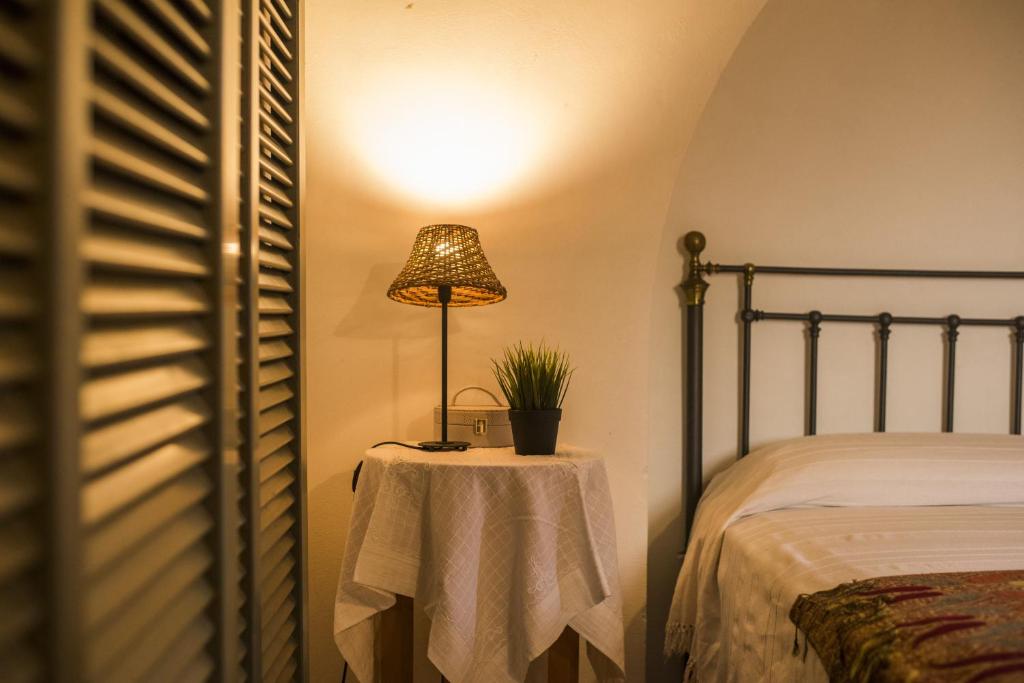 Postel nebo postele na pokoji v ubytování Dammuso Sant'Anna