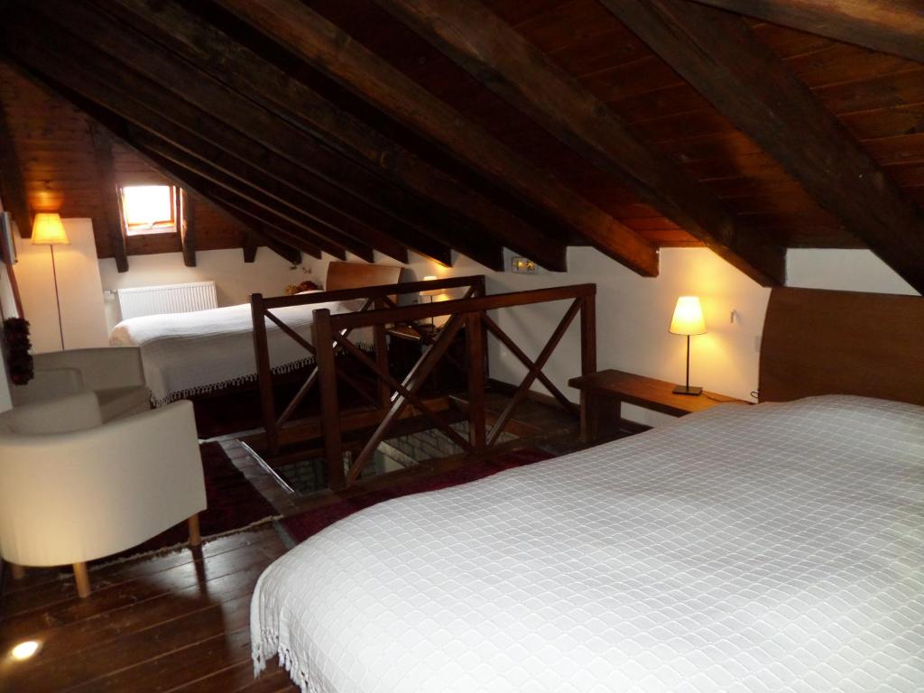 A bed or beds in a room at Arhontiko Aristis