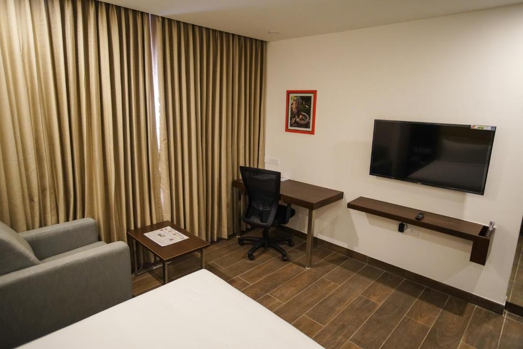 TV a/nebo společenská místnost v ubytování Jaag Hotel
