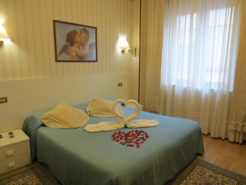 Postel nebo postele na pokoji v ubytování Hotel Italia City Center